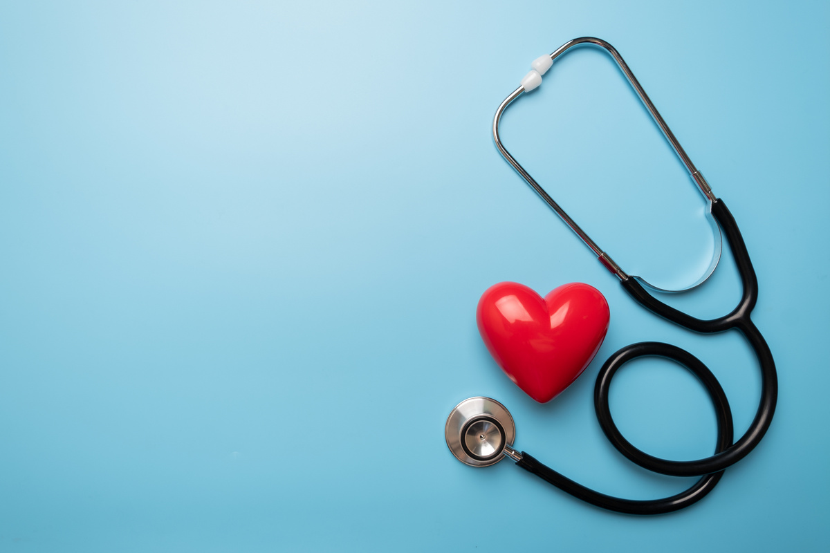 Stethoscope with red heart, healthcare heart check concept, world heart health day, health insurance concept. copy space